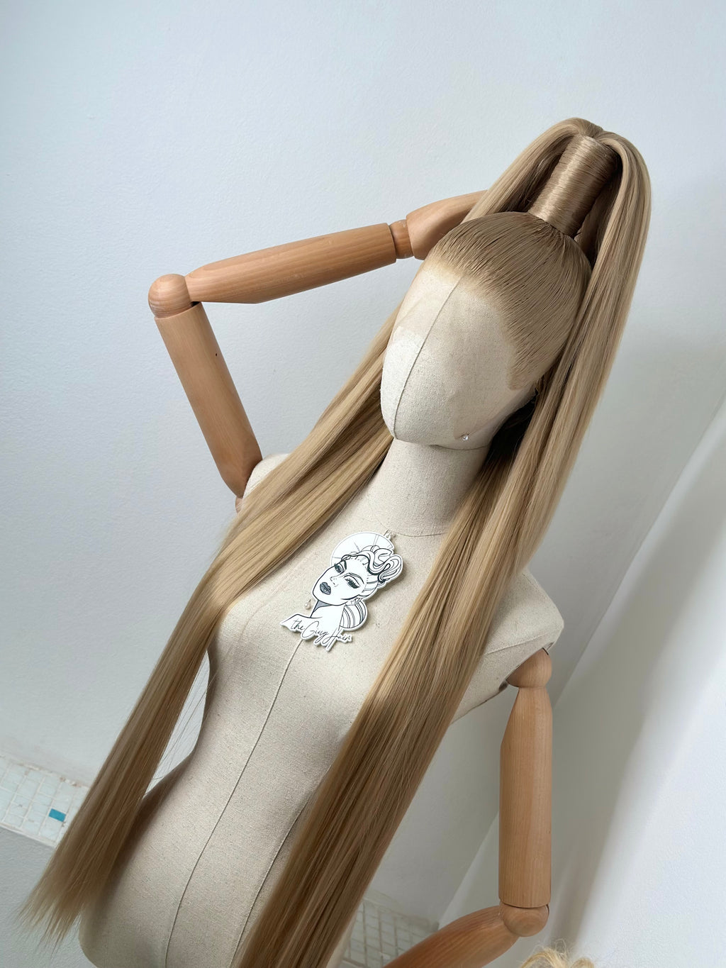 Sleek half up ponytail cool blonde